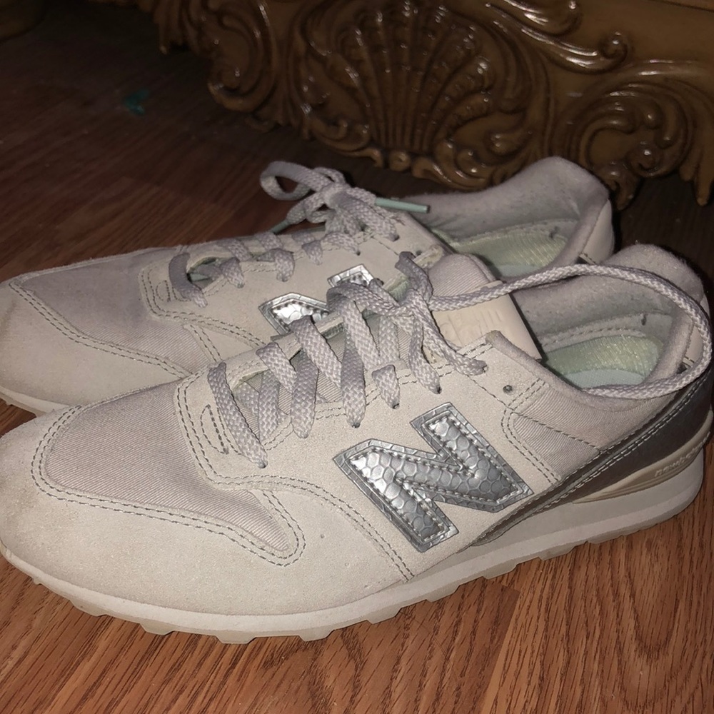 New Balance silver and white sneakers
